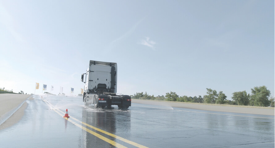 This image shows a truck with Ecopia H002 Tyres on a wet road
